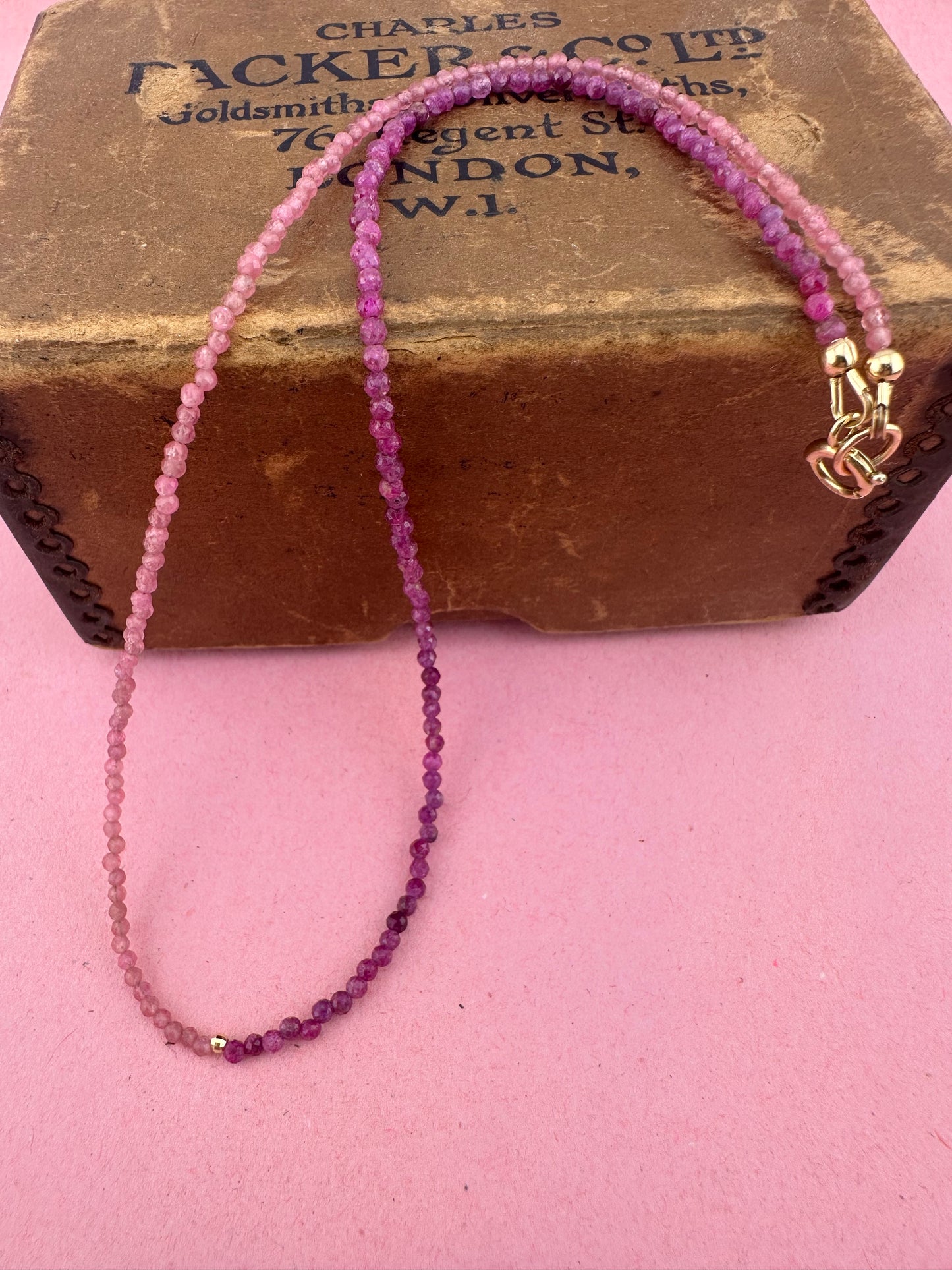 Ruby & Pink tourmaline half and half mini beads with antique 9ct gold bolt clasp and central bead.