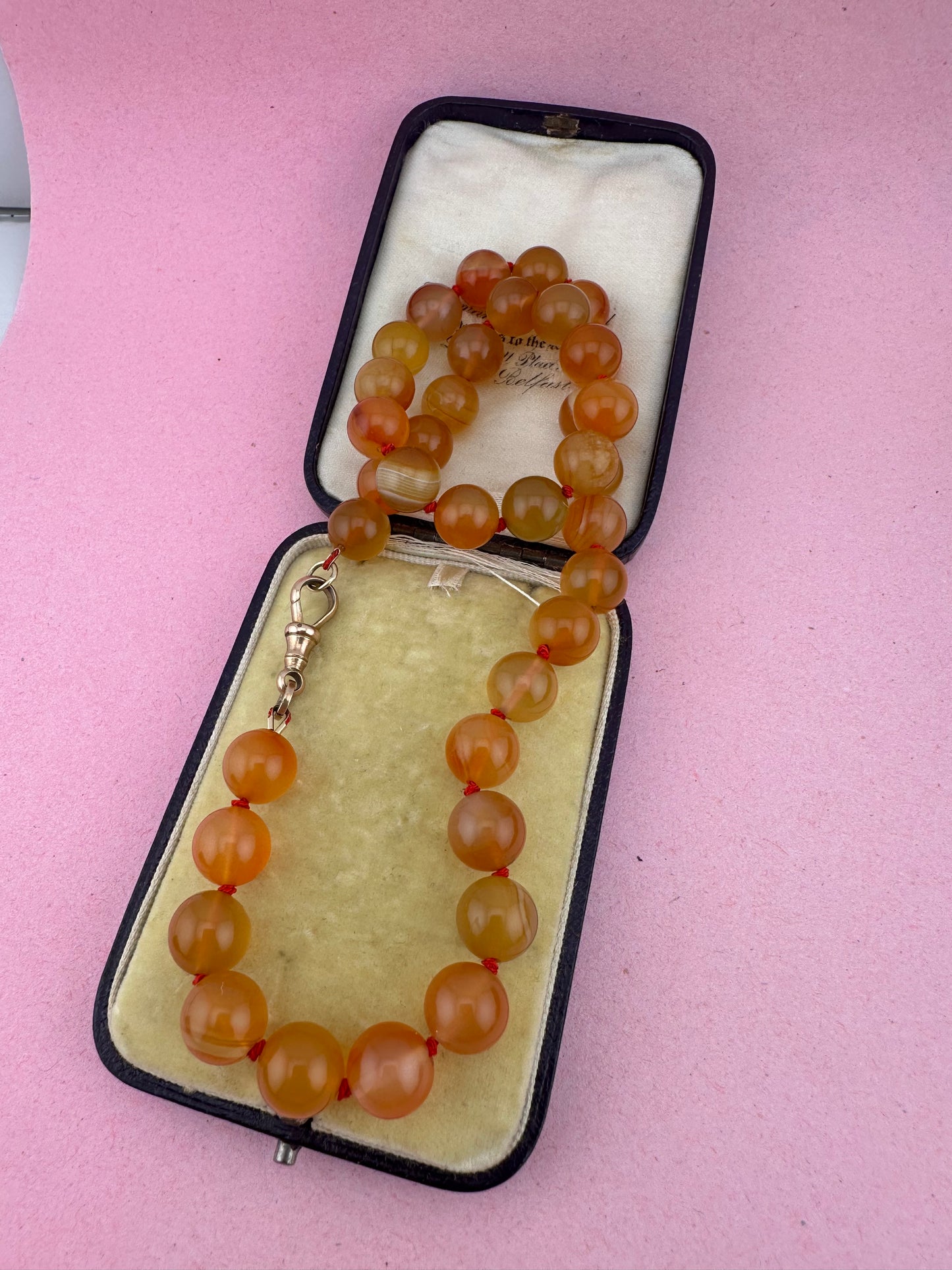 Re-imagined Orange Agate beads with Antique Dog clip