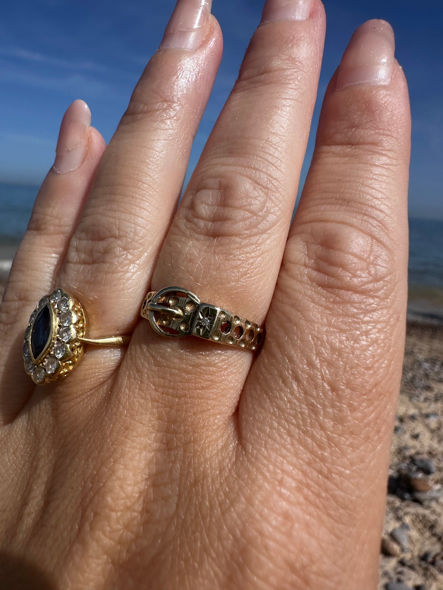 Vintage 9ct Gold Buckle ring with a star set accent diamond.