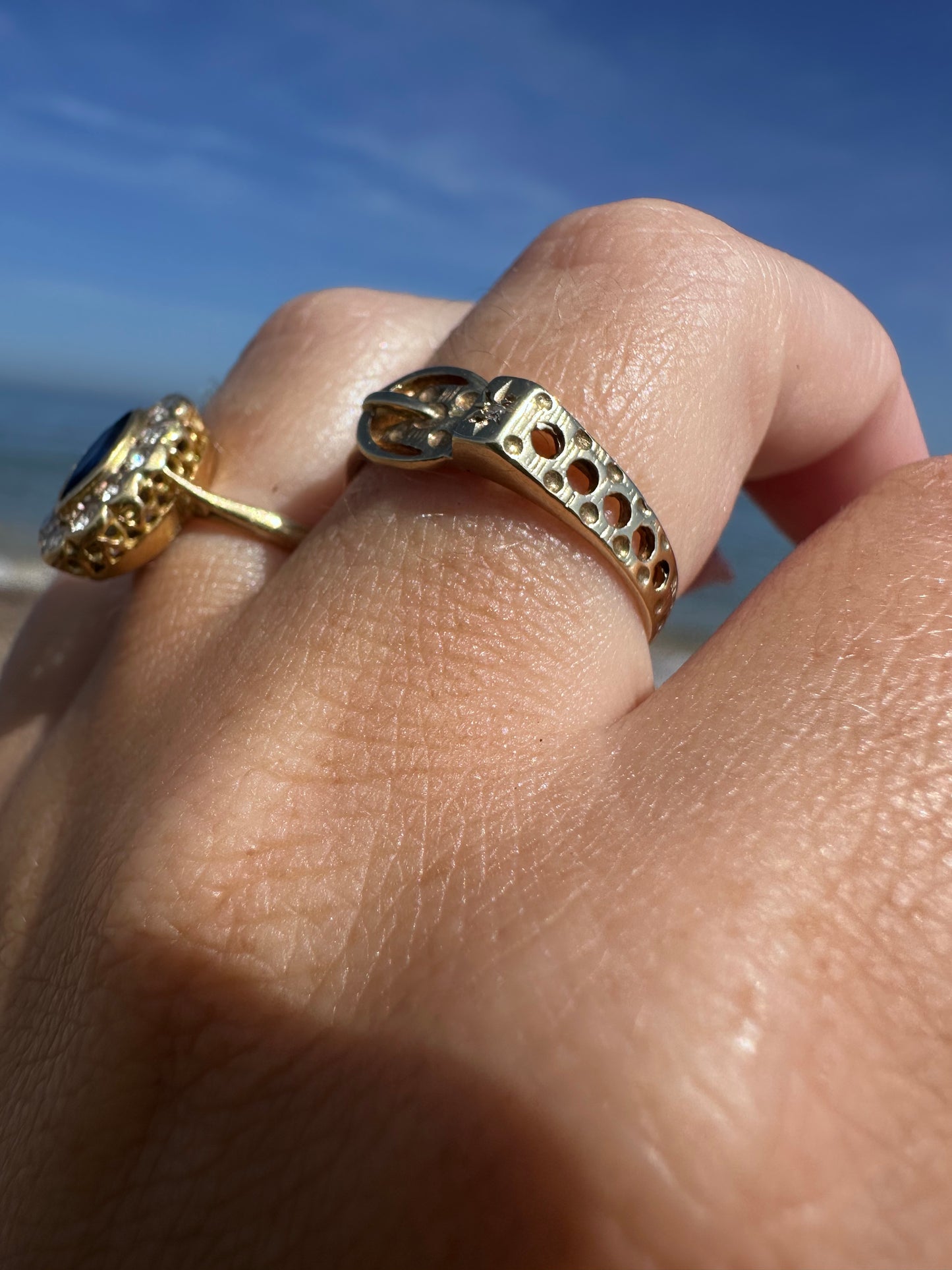 Vintage 9ct Gold Buckle ring with a star set accent diamond.