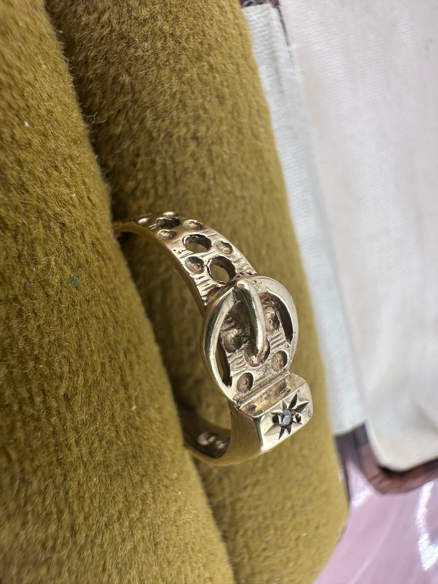 Vintage 9ct Gold Buckle ring with a star set accent diamond.