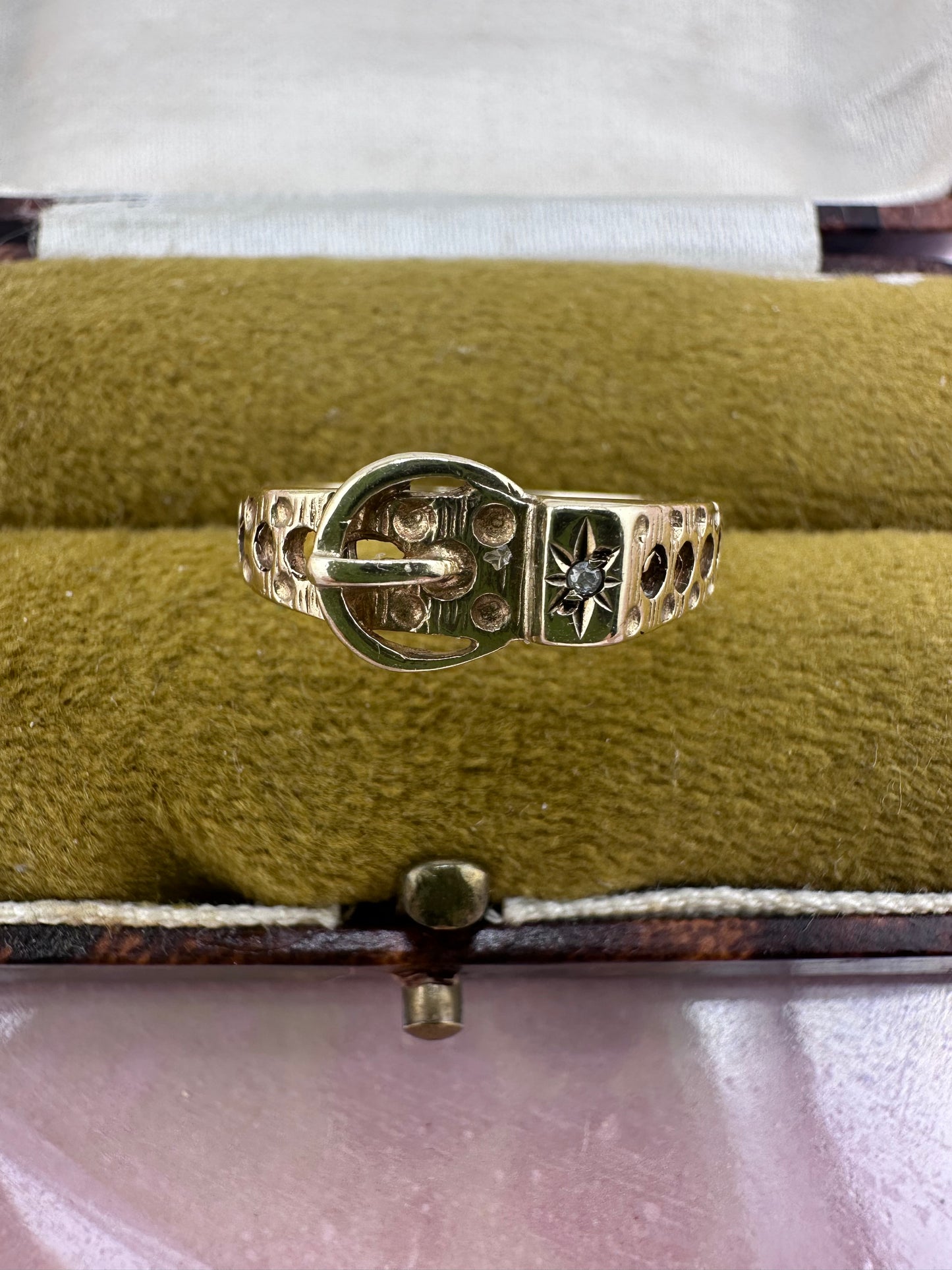 Vintage 9ct Gold Buckle ring with a star set accent diamond.