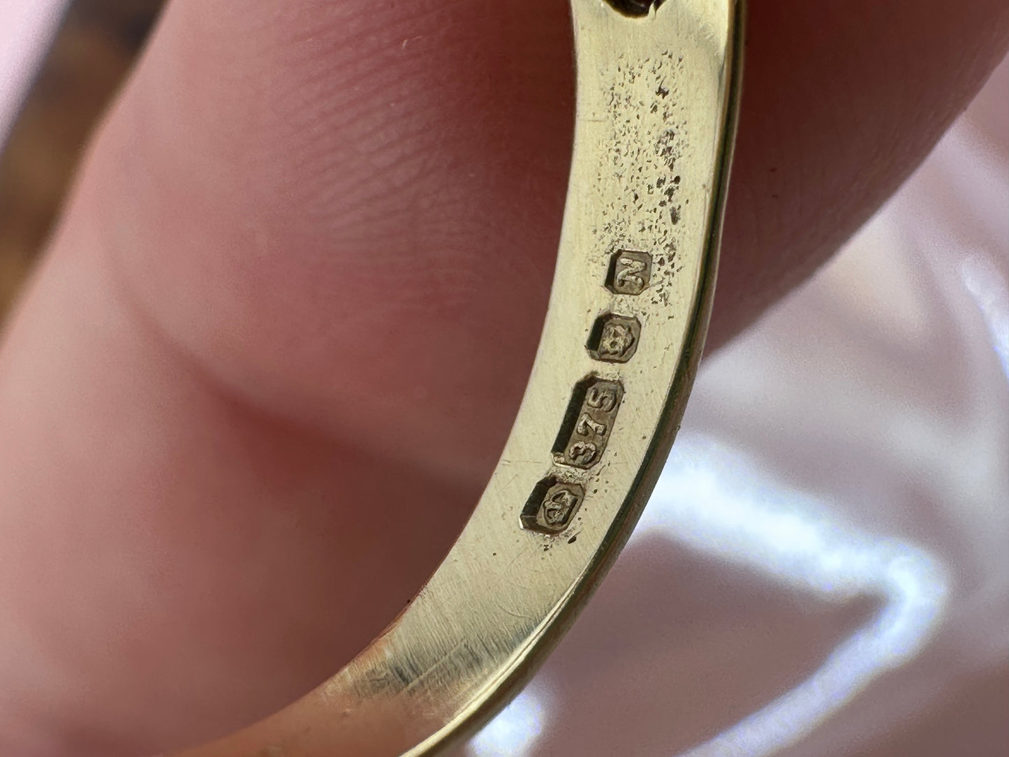 Vintage 9ct Gold Buckle ring with a star set accent diamond.