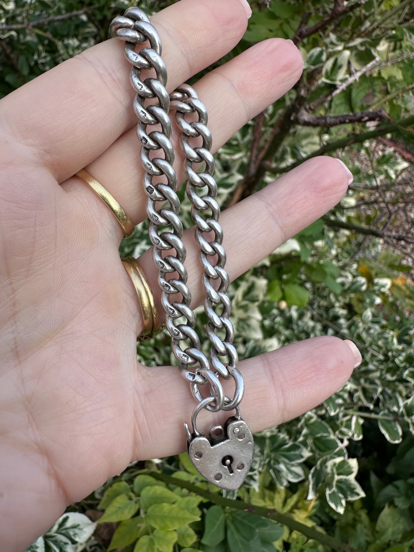 Antique Sterling silver graduated curb bracelet with vintage heart padlock clasp