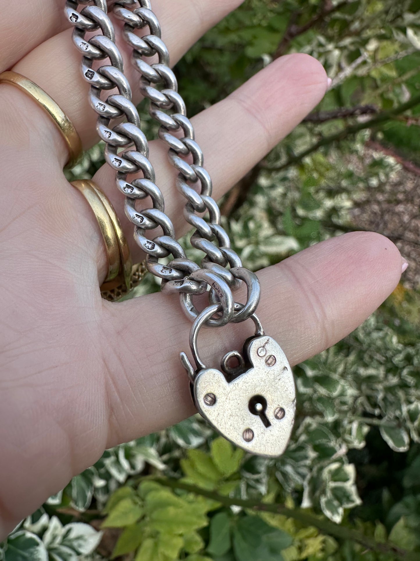 Antique Sterling silver graduated curb bracelet with vintage heart padlock clasp