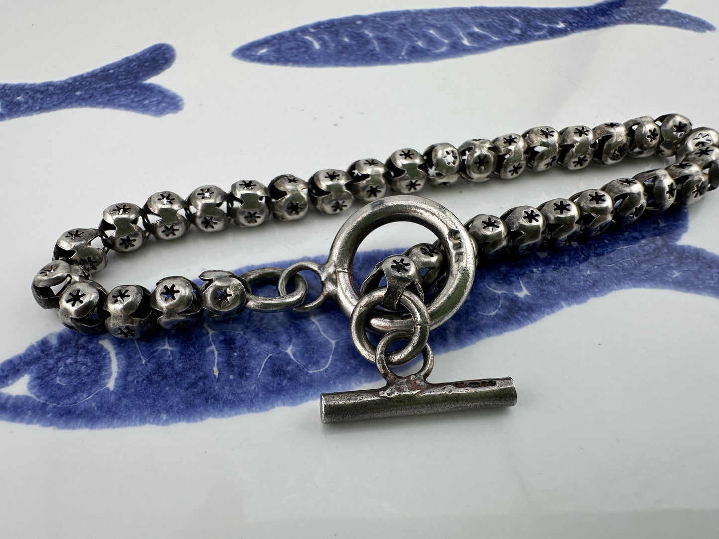 Sterling Silver Star Pierced Ball link bracelet with toggle clasp