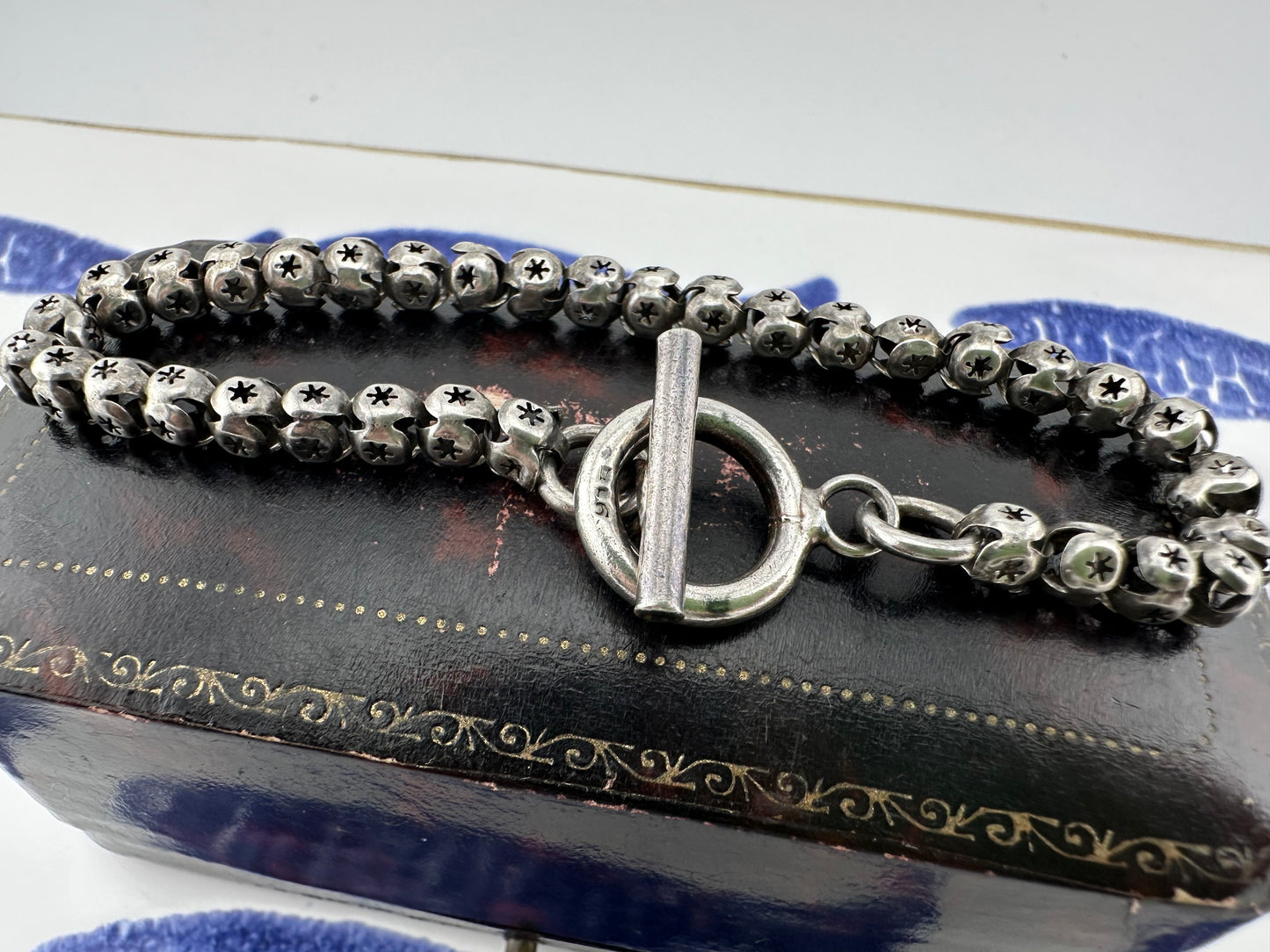 Sterling Silver Star Pierced Ball link bracelet with toggle clasp