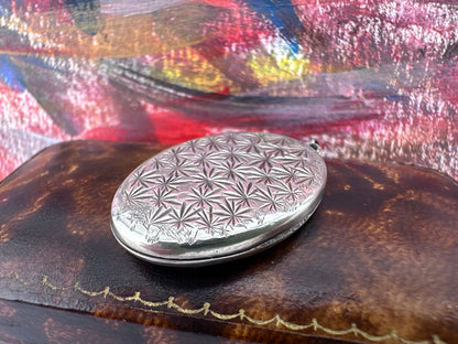 Sterling Silver Star patterned oval locket