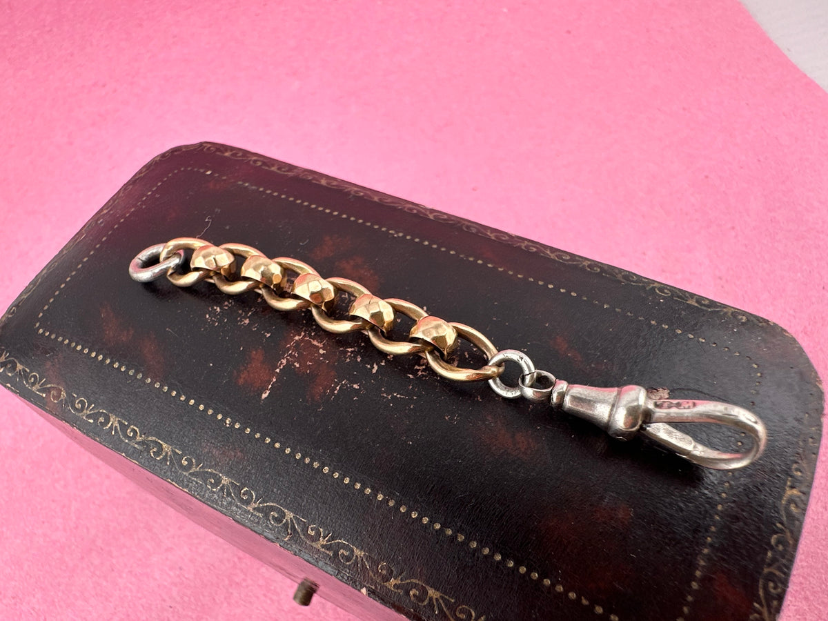 Mix metal extender. 9ct Yellow gold roller ball with sterling silver dog clip.