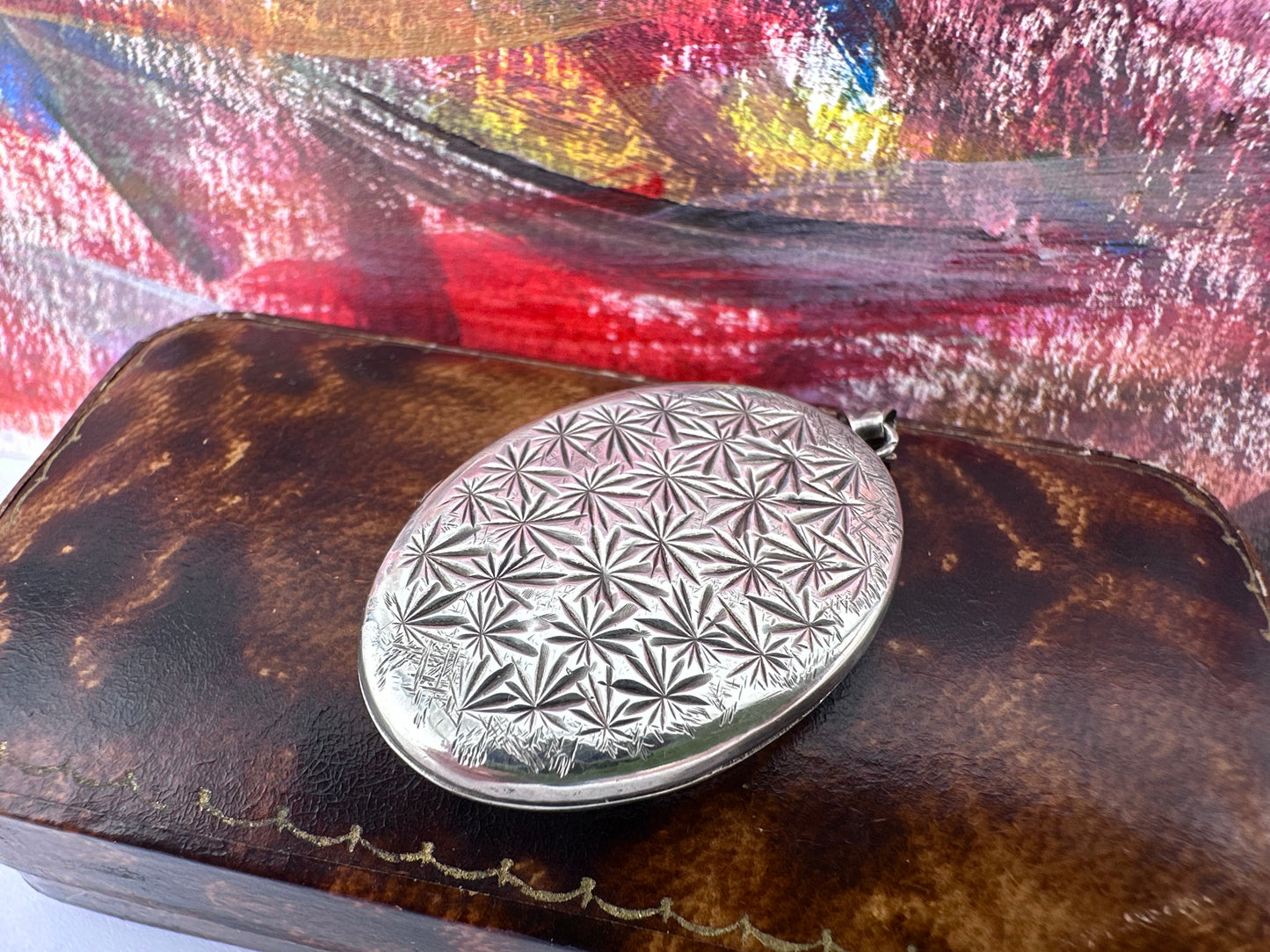 Sterling Silver Star patterned oval locket