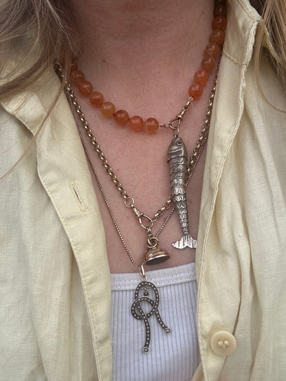 Re-imagined Orange Agate beads with Antique Dog clip