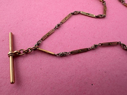 Antique 9ct bi-colour bar and lovers knot Albert chain with floating t-bar, dog clip and bolt clasp