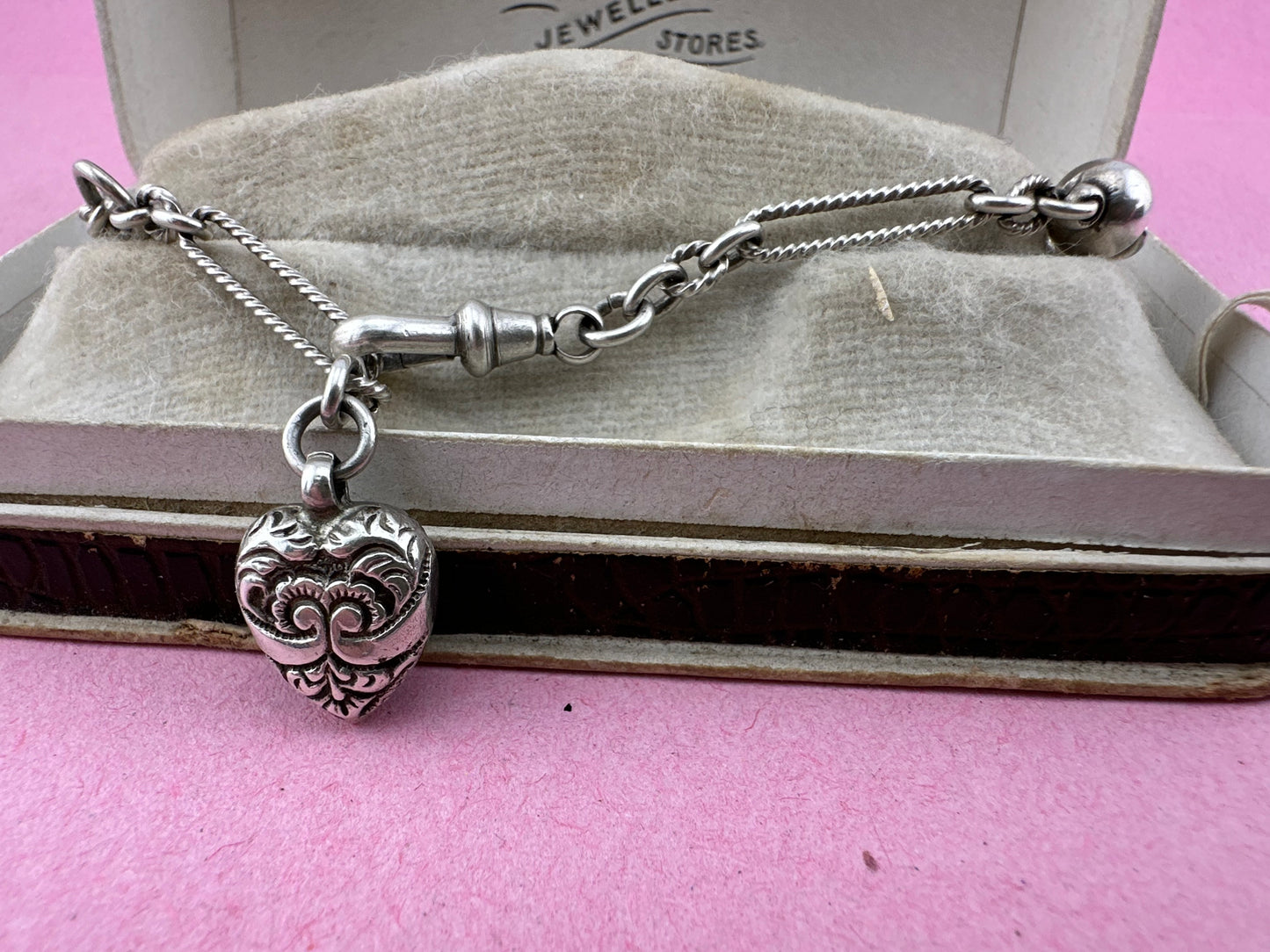 Antique Sterling Silver twist trombone and ball link bracelet with heart charm.