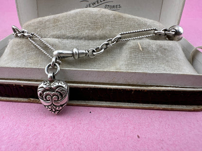 Antique Sterling Silver twist trombone and ball link bracelet with heart charm.
