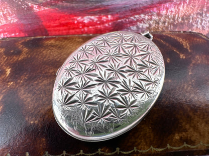 Sterling Silver Star patterned oval locket