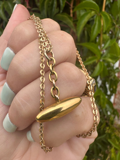 Antique 10ct gold Torpedo pendant