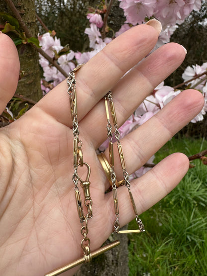 Antique 9ct bi-colour bar and lovers knot Albert chain with floating t-bar, dog clip and bolt clasp