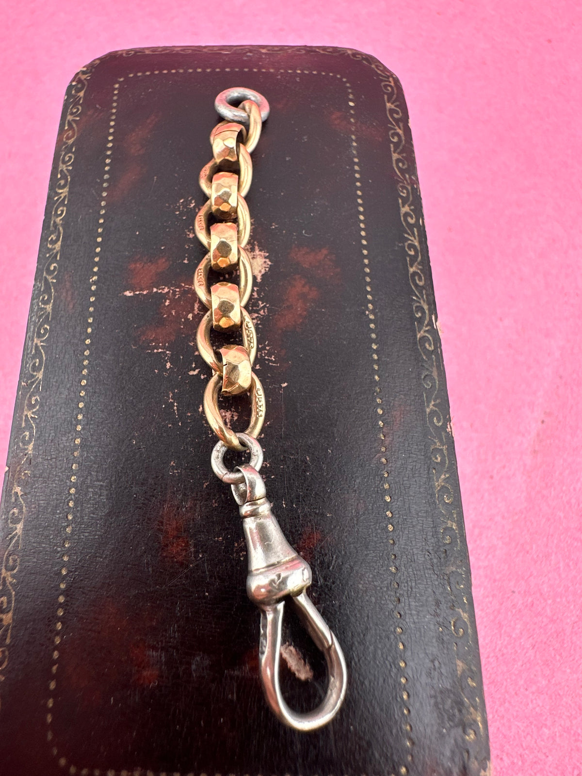 Mix metal extender. 9ct Yellow gold roller ball with sterling silver dog clip.