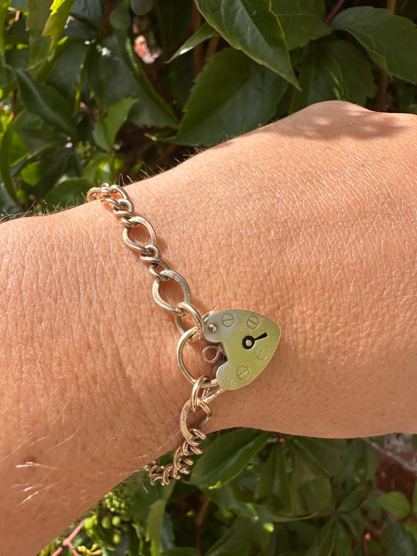 Vintage 9ct Gold Curb and Twist link bracelet with heart padlock