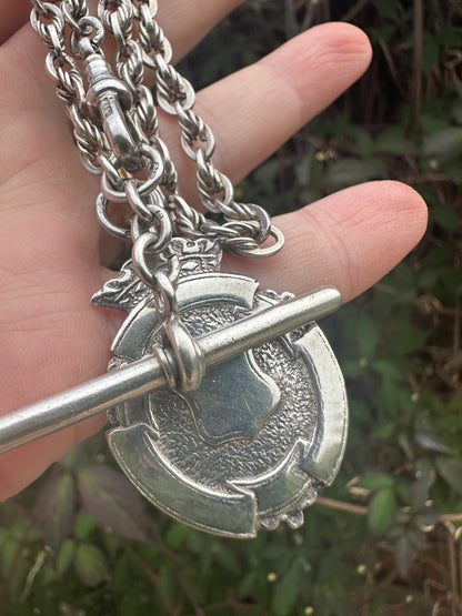 Sterling Silver Lovers Knot Albert chain, with T-bar, dogclip and shield fob.