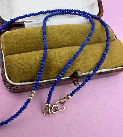 Azure- Lapis Lazuli Mini beaded necklace with asymmetrical design with 9ct antique bolt clasp.