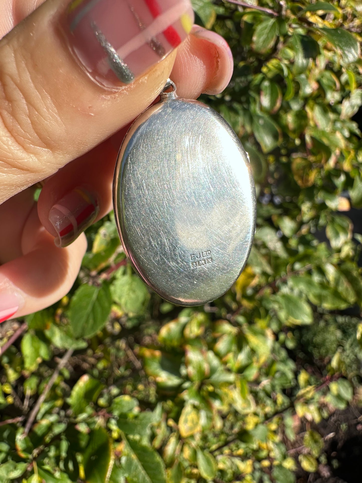 Sterling Silver Star patterned oval locket