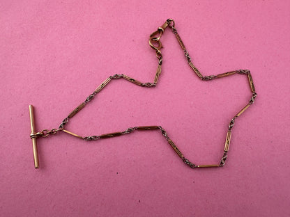 Antique 9ct bi-colour bar and lovers knot Albert chain with floating t-bar, dog clip and bolt clasp