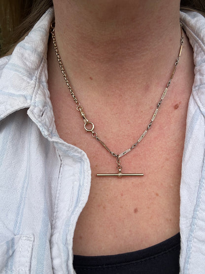 Antique 9ct bi-colour bar and lovers knot Albert chain with floating t-bar, dog clip and bolt clasp