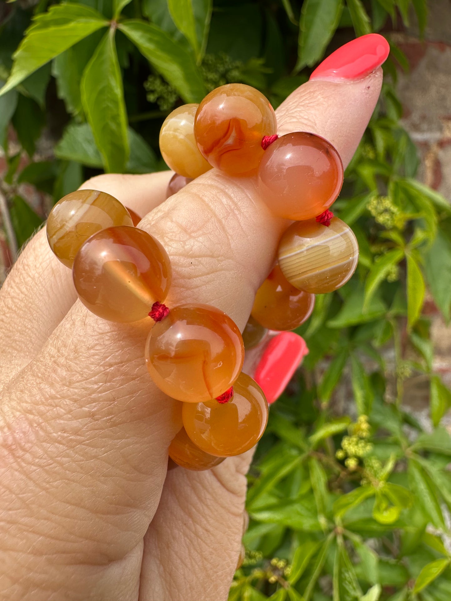 Re-imagined Orange Agate beads with Antique Dog clip