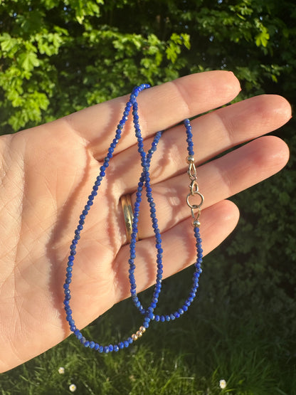 Azure- Lapis Lazuli Mini beaded necklace with asymmetrical design with 9ct antique bolt clasp.