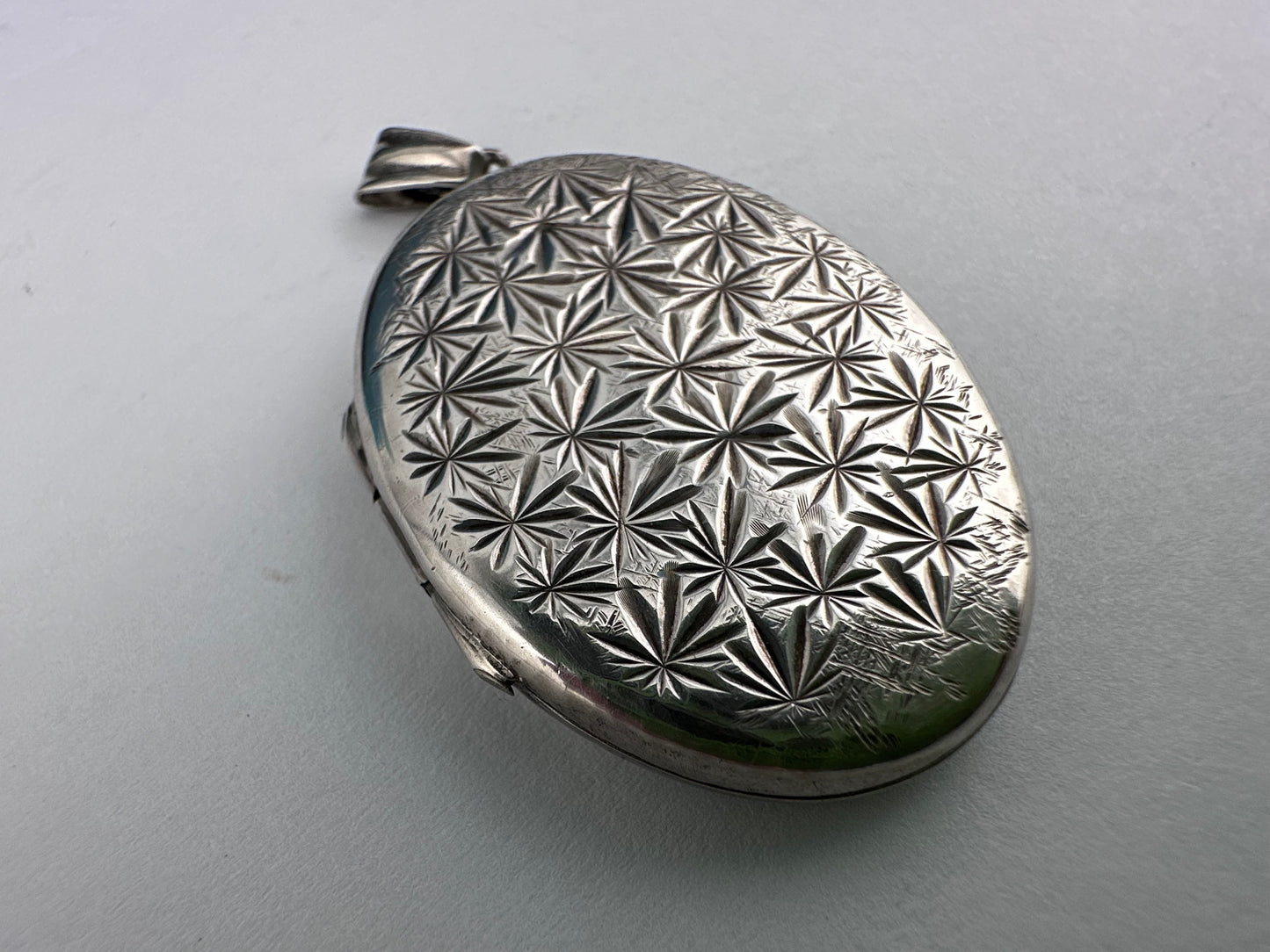 Sterling Silver Star patterned oval locket