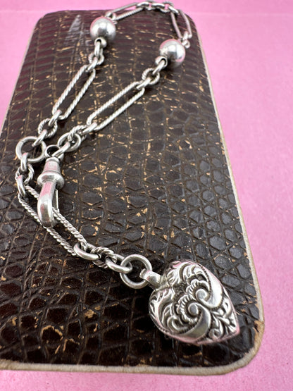 Antique Sterling Silver twist trombone and ball link bracelet with heart charm.