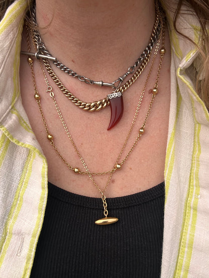 Antique 10ct gold Torpedo pendant