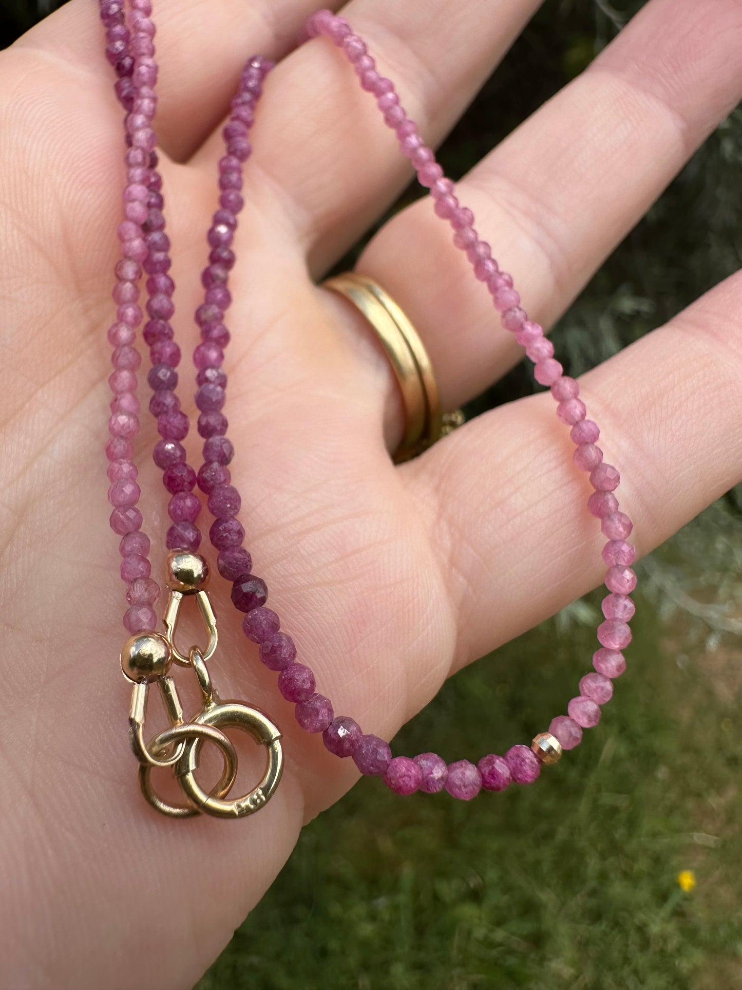 Ruby & Pink tourmaline half and half mini beads with antique 9ct gold bolt clasp and central bead.
