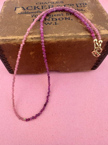 Ruby & Pink tourmaline half and half mini beads with antique 9ct gold bolt clasp and central bead.
