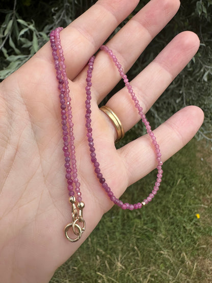 Ruby & Pink tourmaline half and half mini beads with antique 9ct gold bolt clasp and central bead.