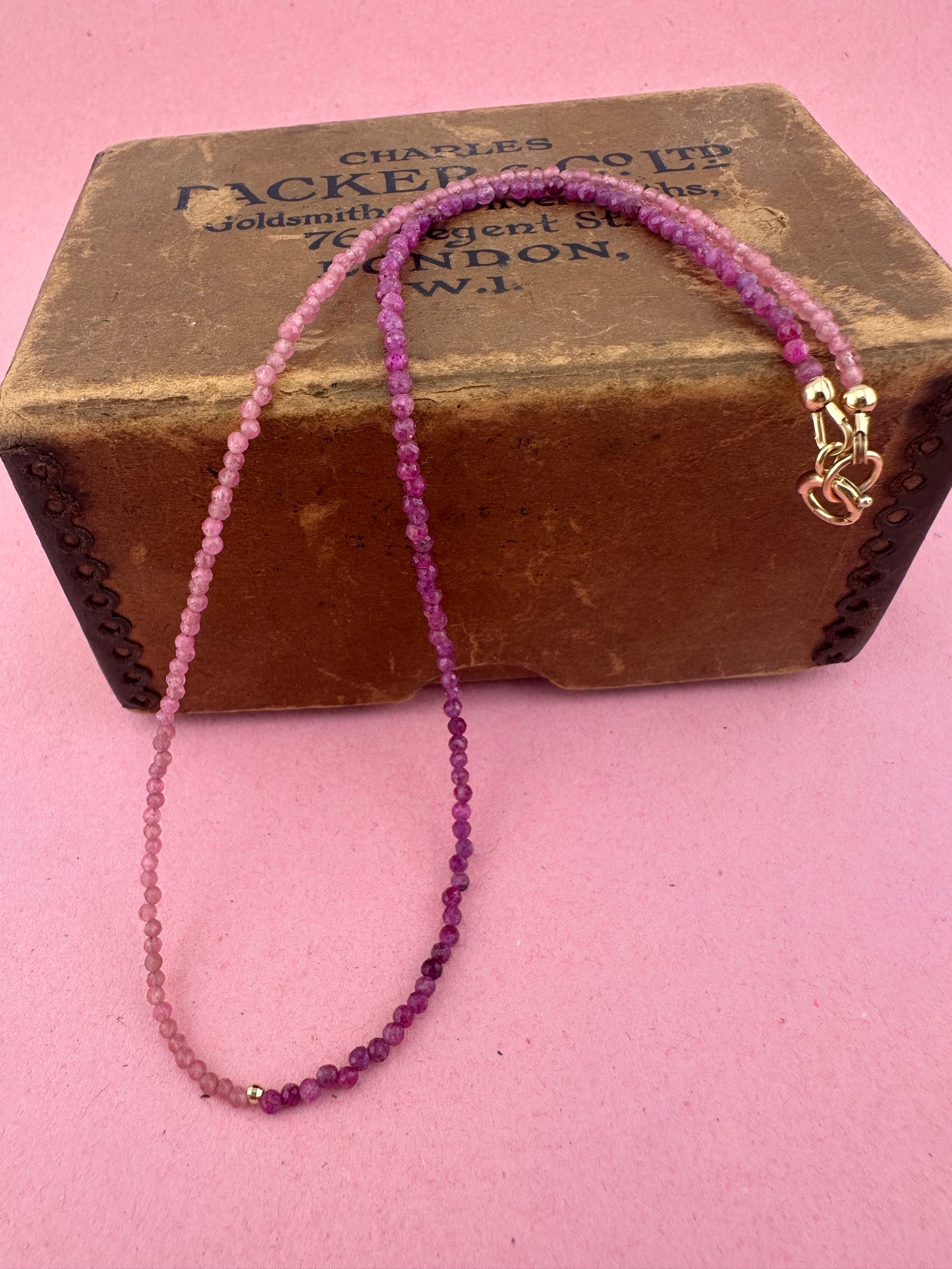 Ruby & Pink tourmaline half and half mini beads with antique 9ct gold bolt clasp and central bead.
