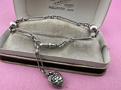 Antique Sterling Silver twist trombone and ball link bracelet with heart charm.