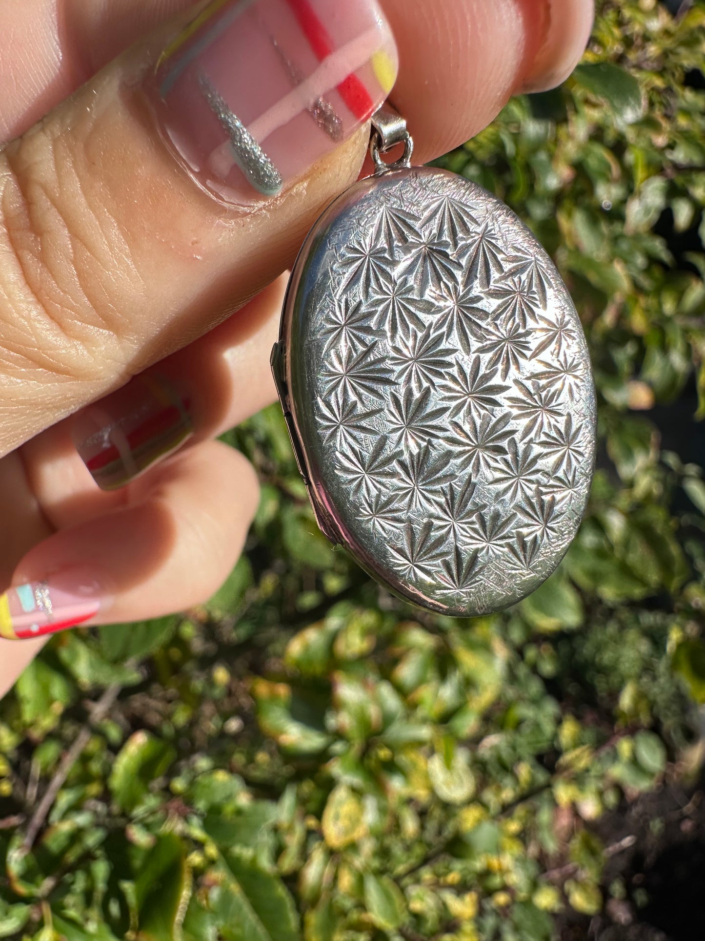 Sterling Silver Star patterned oval locket