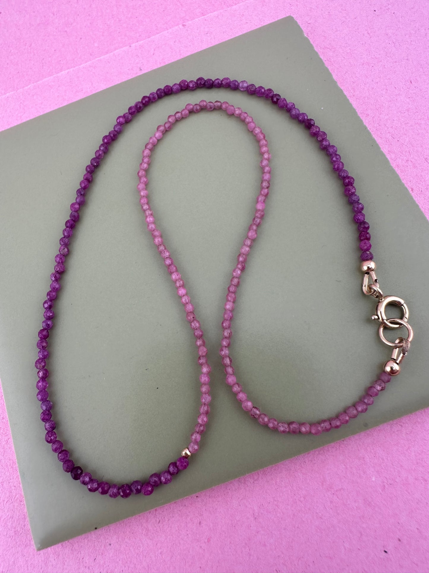 Ruby & Pink tourmaline half and half mini beads with antique 9ct gold bolt clasp and central bead.