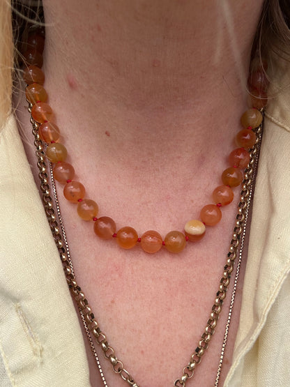 Re-imagined Orange Agate beads with Antique Dog clip