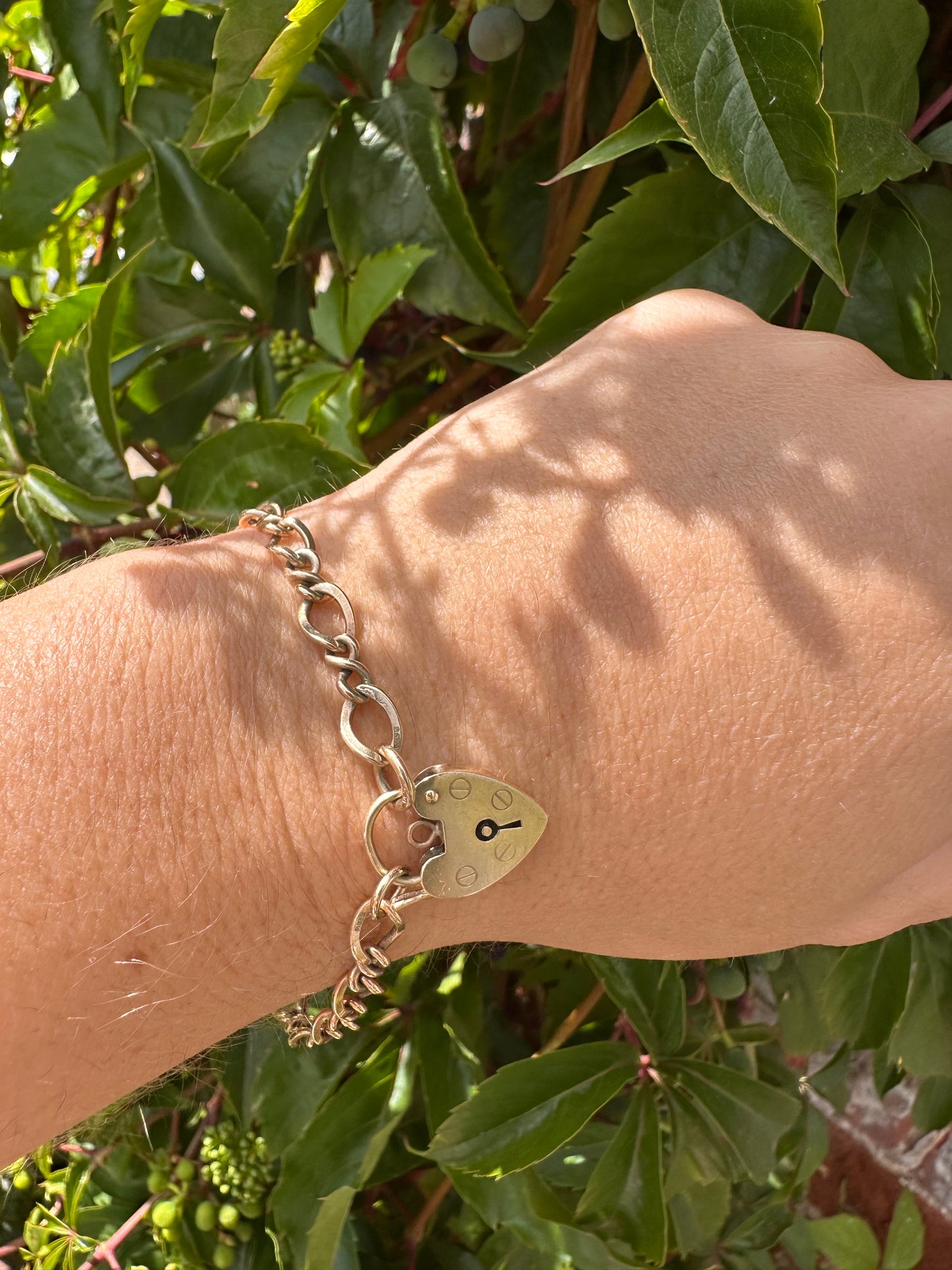 Vintage 9ct Gold Curb and Twist link bracelet with heart padlock