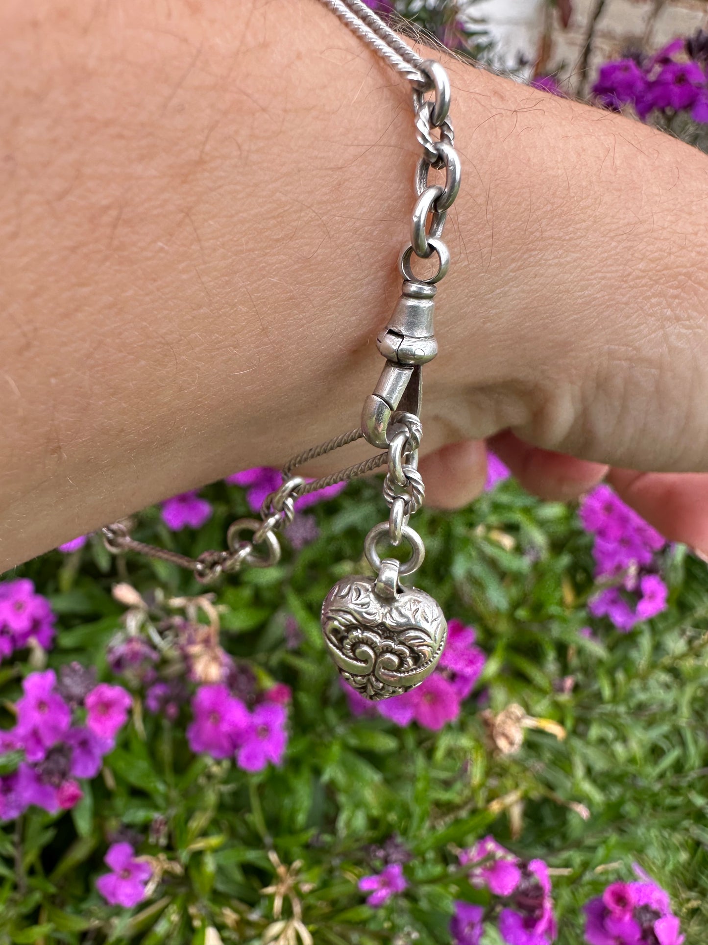Antique Sterling Silver twist trombone and ball link bracelet with heart charm.