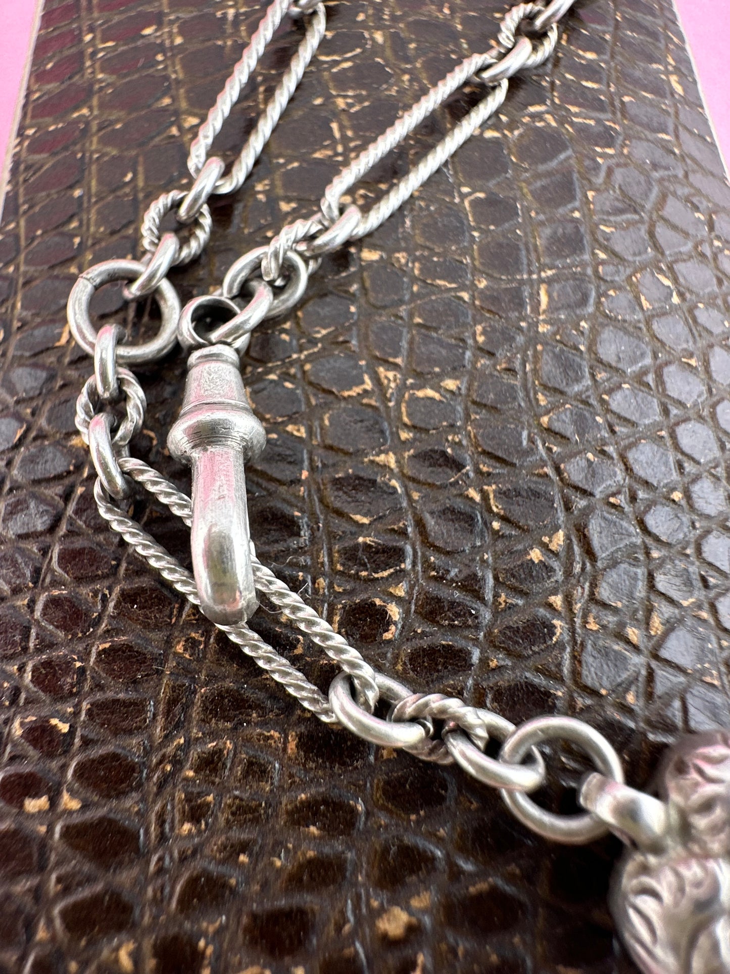 Antique Sterling Silver twist trombone and ball link bracelet with heart charm.