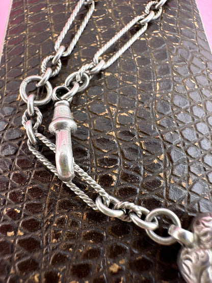 Antique Sterling Silver twist trombone and ball link bracelet with heart charm.