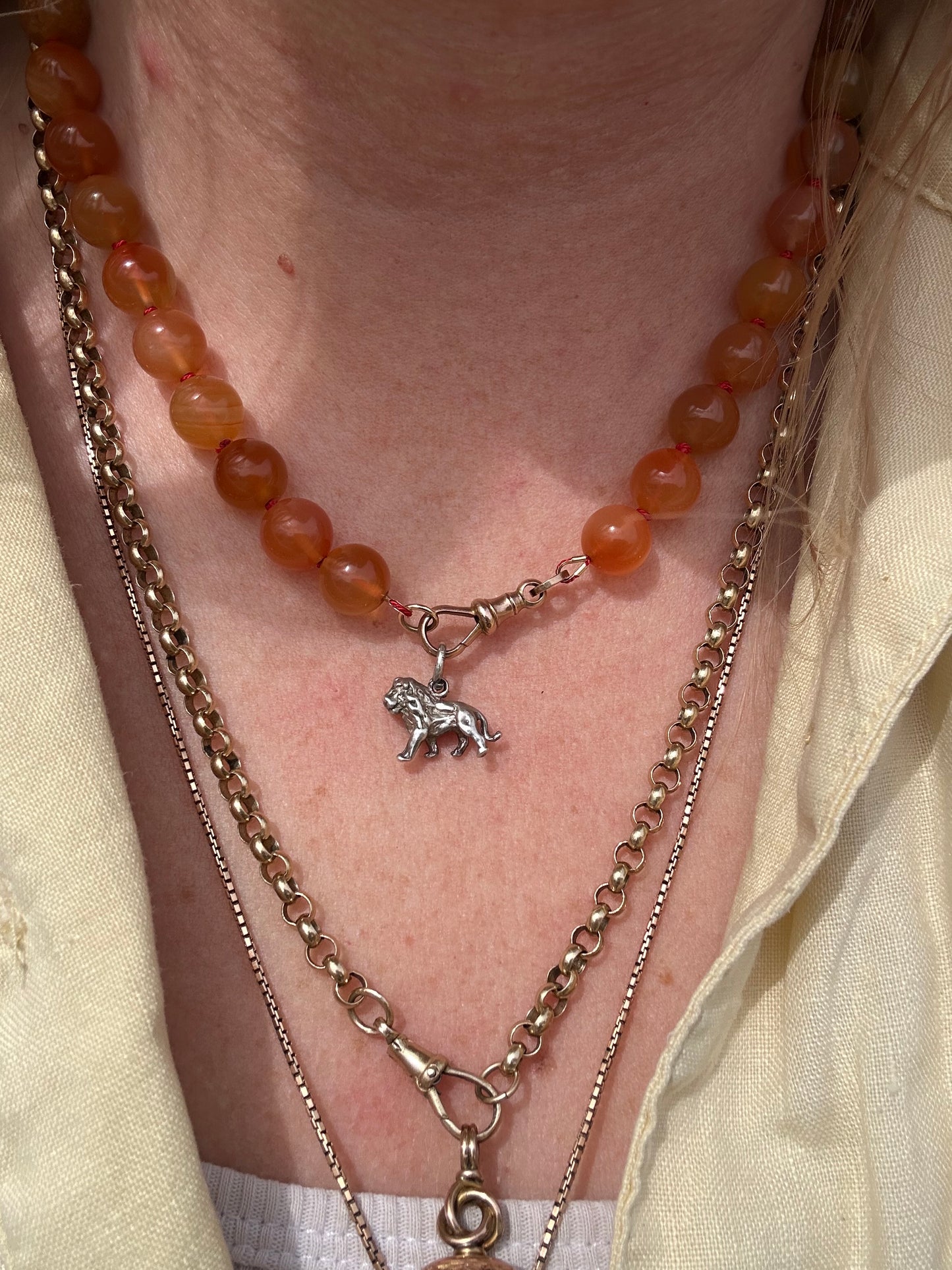 Re-imagined Orange Agate beads with Antique Dog clip