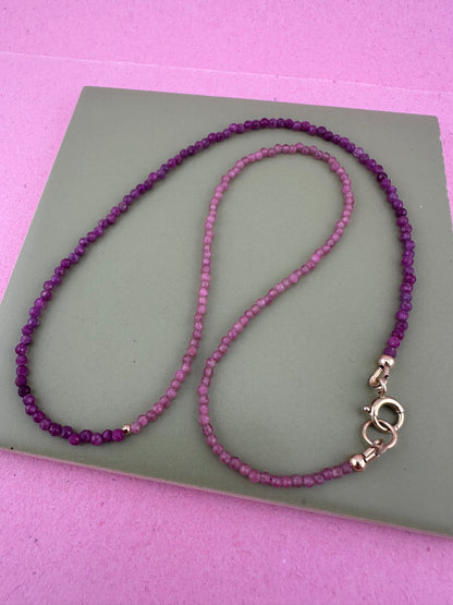 Ruby & Pink tourmaline half and half mini beads with antique 9ct gold bolt clasp and central bead.
