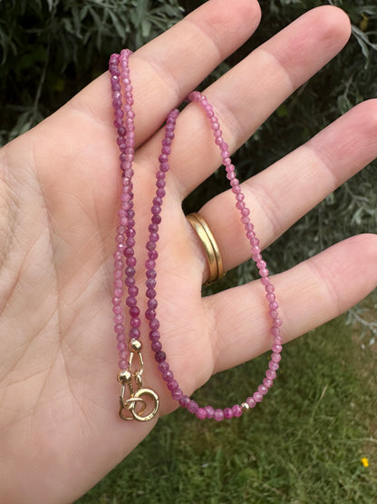 Ruby & Pink tourmaline half and half mini beads with antique 9ct gold bolt clasp and central bead.