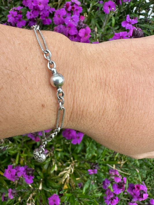 Antique Sterling Silver twist trombone and ball link bracelet with heart charm.