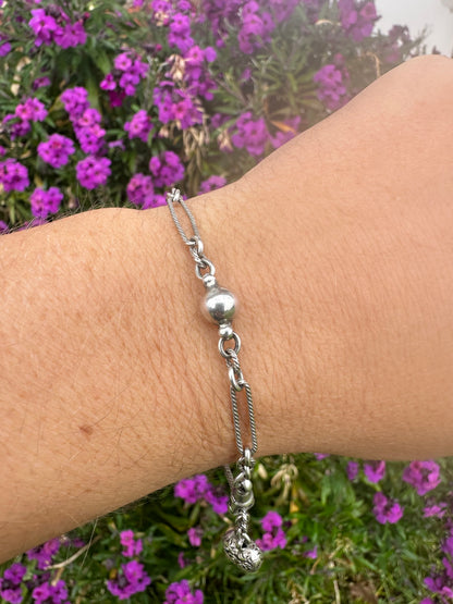 Antique Sterling Silver twist trombone and ball link bracelet with heart charm.